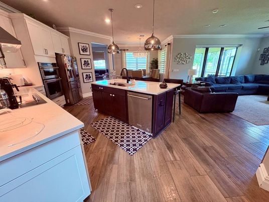 Dining room, Interior, Kitchen, Living room, Pendant Lights, Recessed Lighting, Stainless Steel Appliances, Wood Texture Flooring