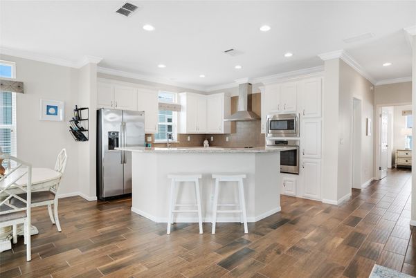 Dining room, Interior, Kitchen, Recessed Lighting, Stainless Steel Appliances, Wood Texture Flooring