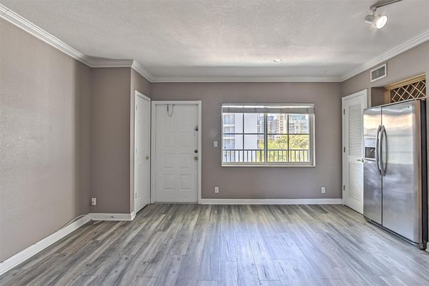 Empty room, Interior, Recessed Lighting, Stainless Steel Appliances, Wood Texture Flooring