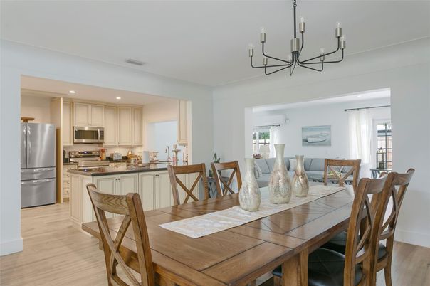 Chandelier, Dining room, Interior, Kitchen, Recessed Lighting, Stainless Steel Appliances, Wood Texture Flooring