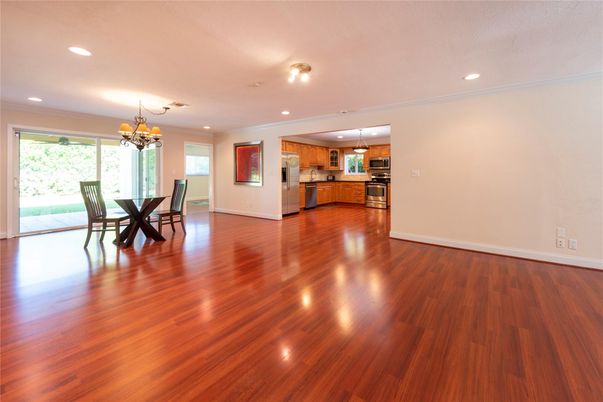 Chandelier, Dining room, Empty room, Interior, Kitchen, Recessed Lighting, Stainless Steel Appliances, Wood Texture Flooring