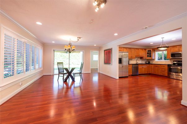 Chandelier, Dining room, Interior, Kitchen, Recessed Lighting, Stainless Steel Appliances, Wood Texture Flooring