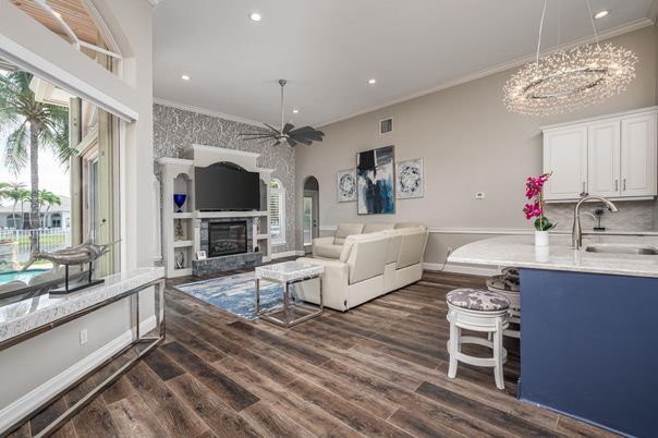 Chandelier, Fireplace, Interior, Kitchen, Living room, Recessed Lighting, Wood Texture Flooring