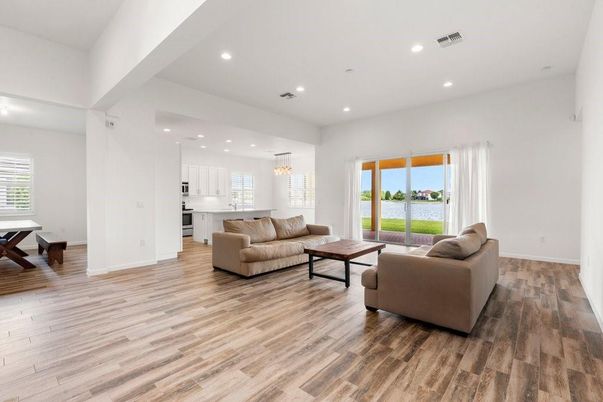 Chandelier, Dining room, Interior, Kitchen, Living room, Pendant Lights, Recessed Lighting, Water, Wood Texture Flooring