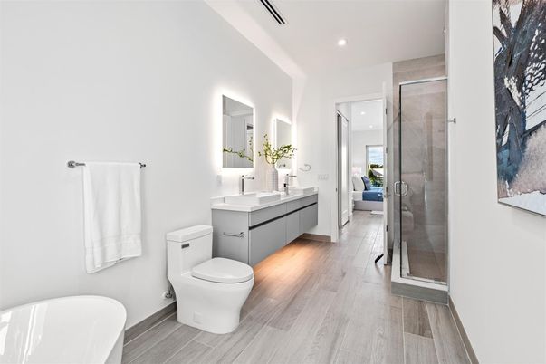 Bathroom, Dual Sink Vanities, Free Standing Baths, Glass Shower, Interior, Recessed Lighting, Wood Texture Flooring