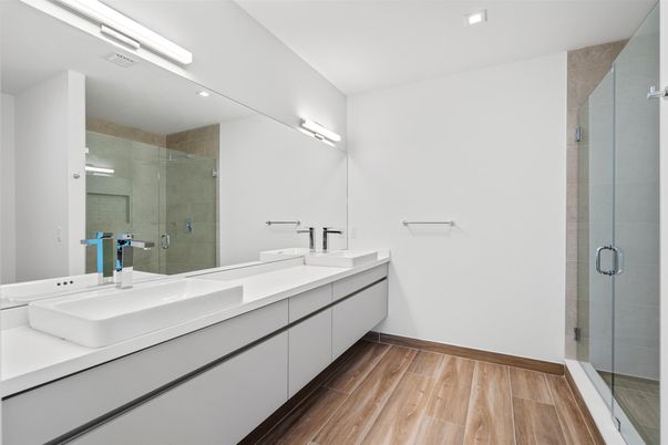 Bathroom, Dual Sink Vanities, Glass Shower, Interior, Recessed Lighting, Wood Texture Flooring