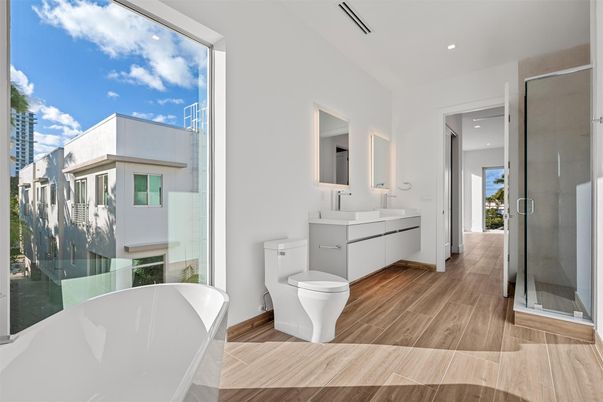 Bathroom, Dual Sink Vanities, Free Standing Baths, Glass Shower, Interior, Recessed Lighting, Wood Texture Flooring