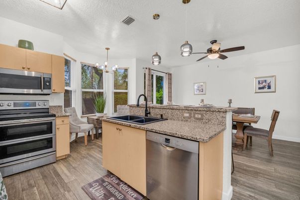 Dining room, Interior, Kitchen, Pendant Lights, Stainless Steel Appliances, Wood Texture Flooring