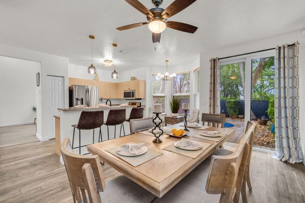 Chandelier, Dining room, Interior, Kitchen, Pendant Lights, Stainless Steel Appliances, Wood Texture Flooring