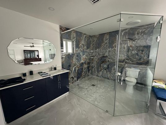 Bathroom, Dual Sink Vanities, Glass Shower, Interior, Marble, Marble Walls, Recessed Lighting