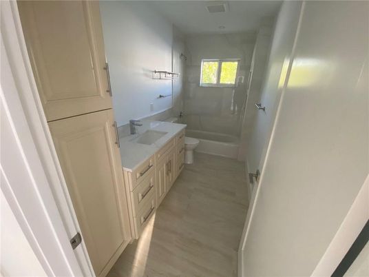 Bathroom, Dual Sink Vanities, Glass Shower, Interior, Wood Texture Flooring