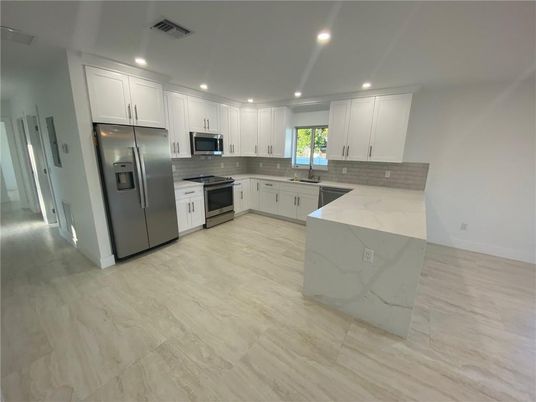 Interior, Kitchen, Recessed Lighting, Stainless Steel Appliances, Wood Texture Flooring