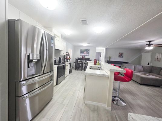 Dining room, Interior, Kitchen, Living room, Stainless Steel Appliances, Wood Texture Flooring
