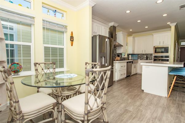 Dining room, Interior, Kitchen, Recessed Lighting, Stainless Steel Appliances, Wood Texture Flooring