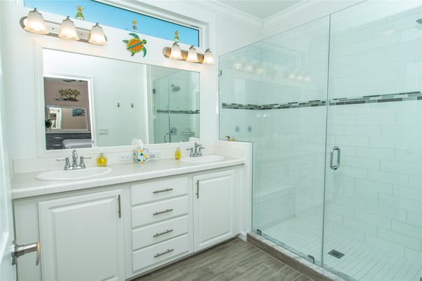 Bathroom, Dual Sink Vanities, Glass Shower, Interior, Tile Countertops, Wood Texture Flooring