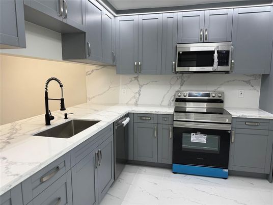 Interior, Kitchen, Marble, Marble Walls, Stainless Steel Appliances
