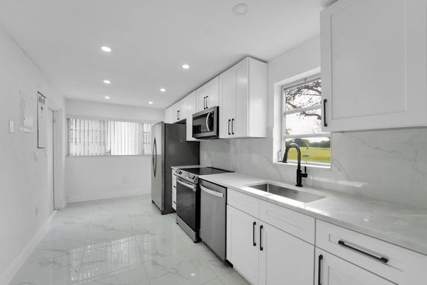 Interior, Kitchen, Marble, Marble Walls, Recessed Lighting, Stainless Steel Appliances