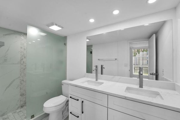 Bathroom, Dual Sink Vanities, Glass Shower, Interior, Marble, Marble Walls, Recessed Lighting