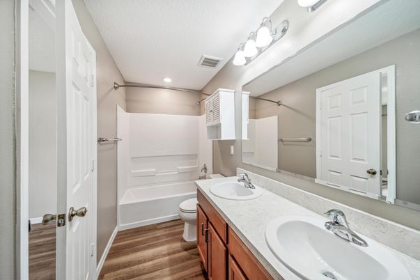 Bathroom, Dual Sink Vanities, Interior, Recessed Lighting, Walk-in Closets, Wood Texture Flooring