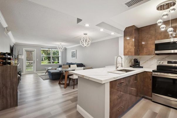 Dining room, Interior, Kitchen, Living room, Pendant Lights, Recessed Lighting, Stainless Steel Appliances, Wood Texture Flooring