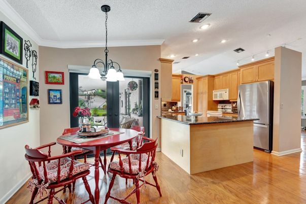 Dining room, Interior, Kitchen, Pendant Lights, Recessed Lighting, Stainless Steel Appliances, Wood Texture Flooring