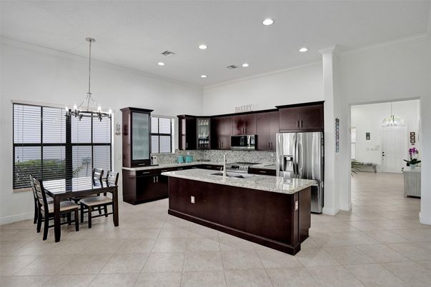 Chandelier, Dining room, Interior, Kitchen, Pendant Lights, Recessed Lighting, Stainless Steel Appliances