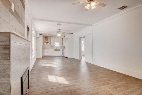 Empty room, Fireplace, Interior, Kitchen, Recessed Lighting, Wood Texture Flooring