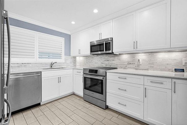 Interior, Kitchen, Recessed Lighting, Stainless Steel Appliances, Wood Texture Flooring