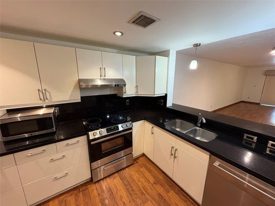 Interior, Kitchen, Pendant Lights, Recessed Lighting, Stainless Steel Appliances, Wood Texture Flooring
