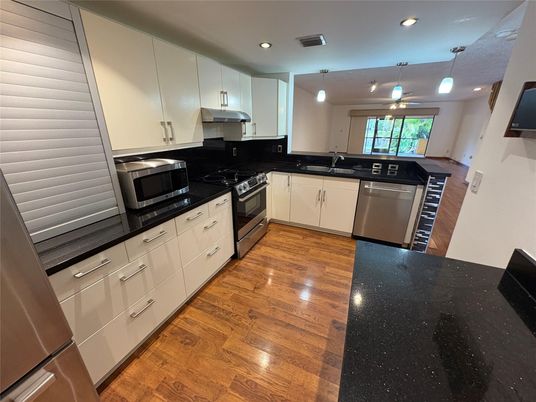 Interior, Kitchen, Pendant Lights, Recessed Lighting, Stainless Steel Appliances, Wood Texture Flooring