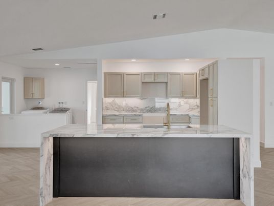 Interior, Kitchen, Recessed Lighting, Washer, Wood Texture Flooring