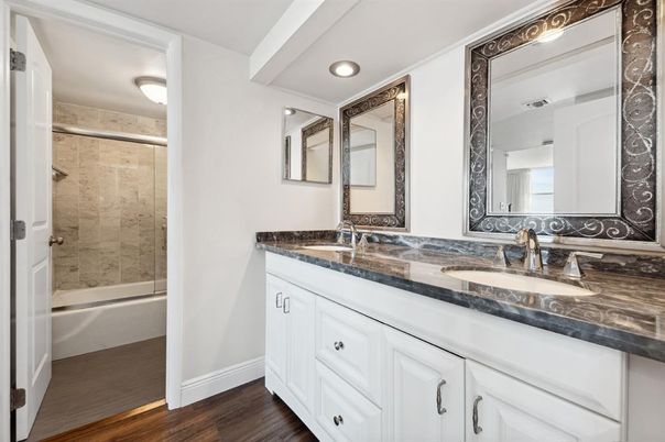 Bathroom, Dual Sink Vanities, Glass Shower, Interior, Recessed Lighting, Wood Texture Flooring