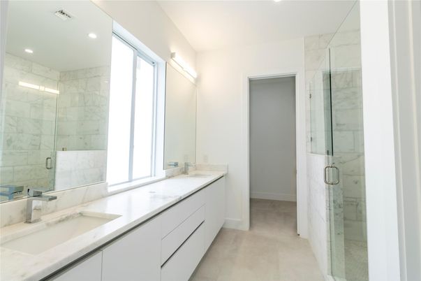 Bathroom, Dual Sink Vanities, Glass Shower, Interior, Marble Walls, Recessed Lighting