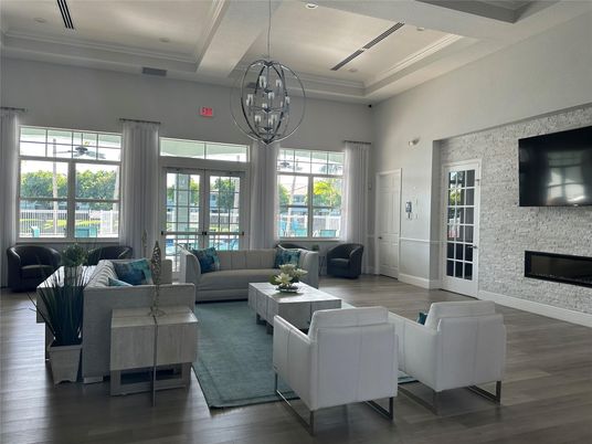 Chandelier, Fireplace, Interior, Living room, Recessed Lighting, Stone Walls, Wood Texture Flooring