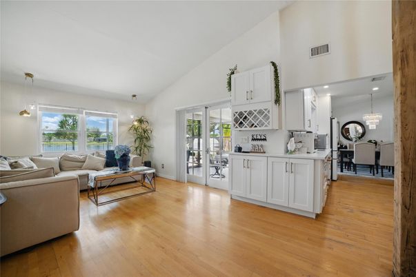 Chandelier, Dining room, Interior, Living room, Pendant Lights, Recessed Lighting, Wood Texture Flooring