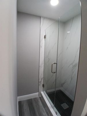 Bathroom, Glass Shower, Interior, Marble Walls, Recessed Lighting, Wood Texture Flooring