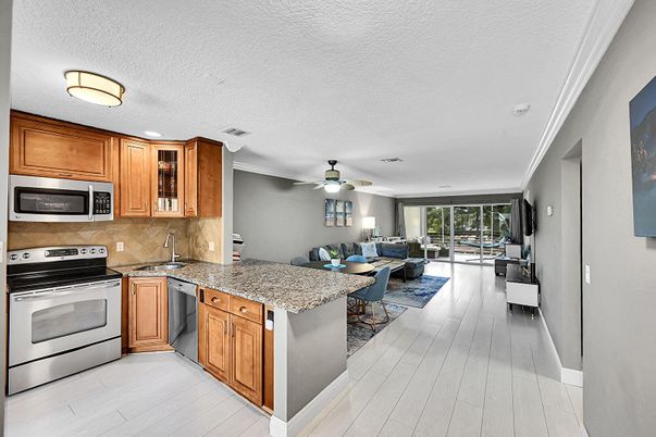 Dining room, Interior, Kitchen, Living room, Recessed Lighting, Stainless Steel Appliances, Wood Texture Flooring
