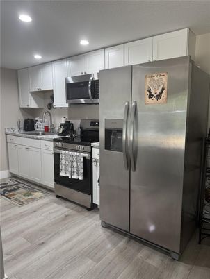 Interior, Kitchen, Recessed Lighting, Stainless Steel Appliances, Wood Texture Flooring