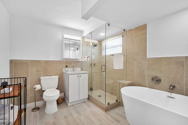 Bathroom, Free Standing Baths, Glass Shower, Interior, Recessed Lighting, Wood Texture Flooring