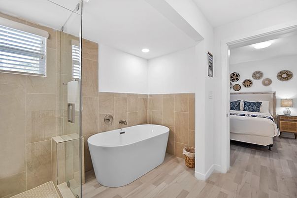 Bathroom, Bedroom, Free Standing Baths, Glass Shower, Interior, Recessed Lighting, Wood Texture Flooring