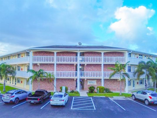 Exterior, Facade, Brick Facade, Condo Building