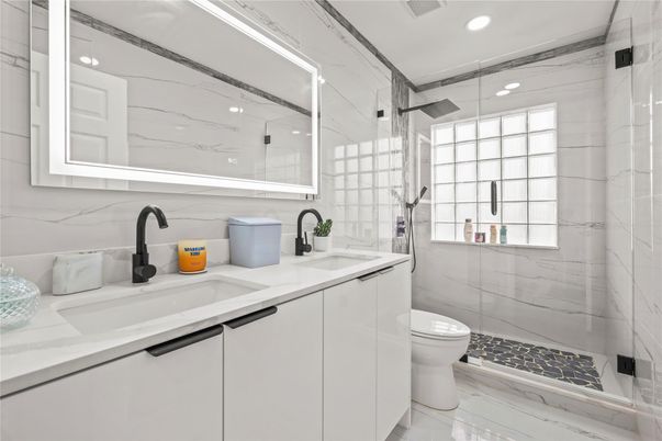 Bathroom, Dual Sink Vanities, Glass Shower, Interior, Marble, Marble Walls, Recessed Lighting