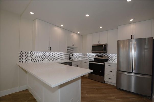 Interior, Kitchen, Recessed Lighting, Stainless Steel Appliances, Wood Texture Flooring
