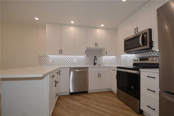 Interior, Kitchen, Recessed Lighting, Stainless Steel Appliances, Wood Texture Flooring