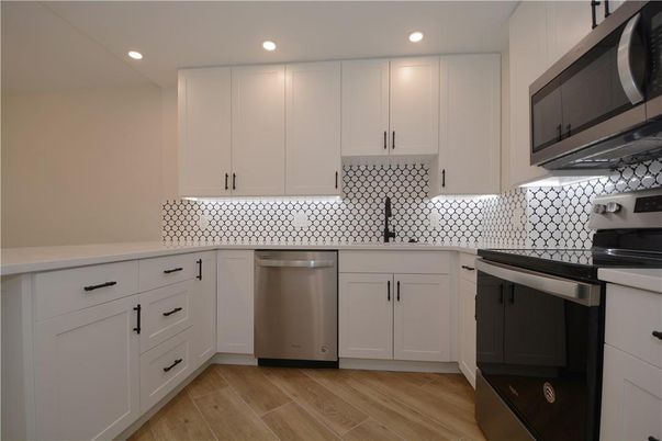 Interior, Kitchen, Recessed Lighting, Stainless Steel Appliances, Wood Texture Flooring