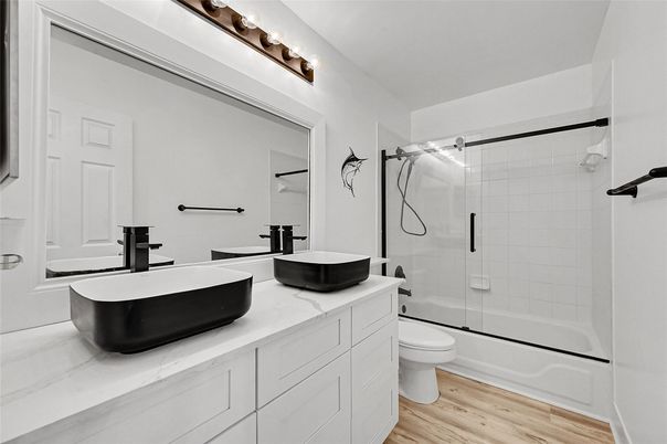 Bathroom, Dual Sink Vanities, Free Standing Baths, Glass Shower, Interior, Wood Texture Flooring