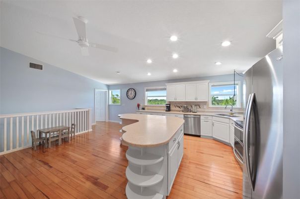 Dining room, Interior, Kitchen, Recessed Lighting, Stainless Steel Appliances, Wood Texture Flooring