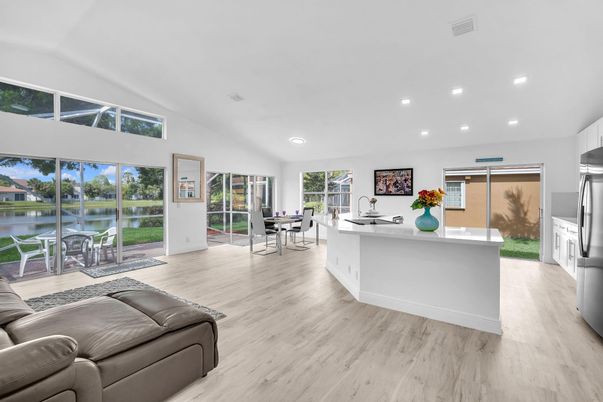 Dining room, Interior, Kitchen, Living room, Recessed Lighting, Water, Wood Texture Flooring