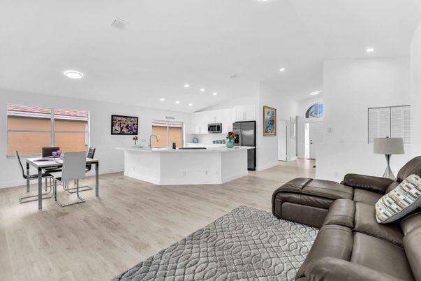 Dining room, Interior, Kitchen, Living room, Recessed Lighting, Stainless Steel Appliances, Wood Texture Flooring
