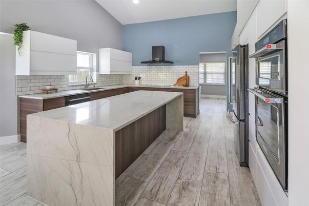 Dining room, Interior, Kitchen, Living room, Pendant Lights, Recessed Lighting, Stainless Steel Appliances, Wood Texture Flooring